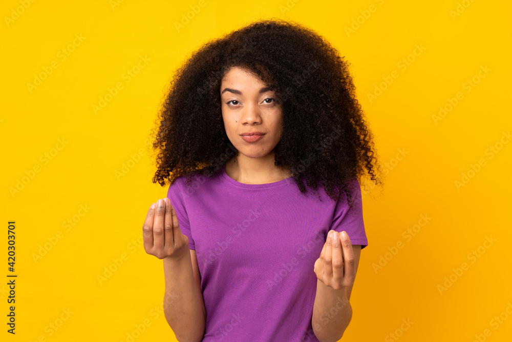 Young african american woman over isolated background making money gesture but is ruined Young african american woman over isolated background making money gesture but is ruined