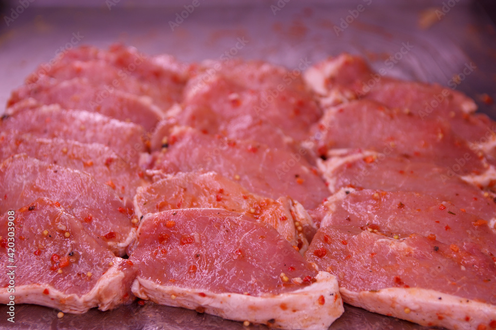 Cutting juicy beautiful pieces of pork carbonate