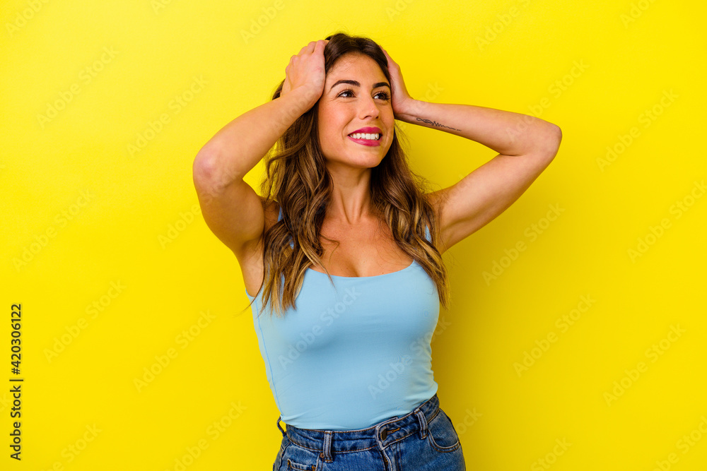 Young caucasian woman isolated on yellow background Young caucasian woman isolated on yellow background