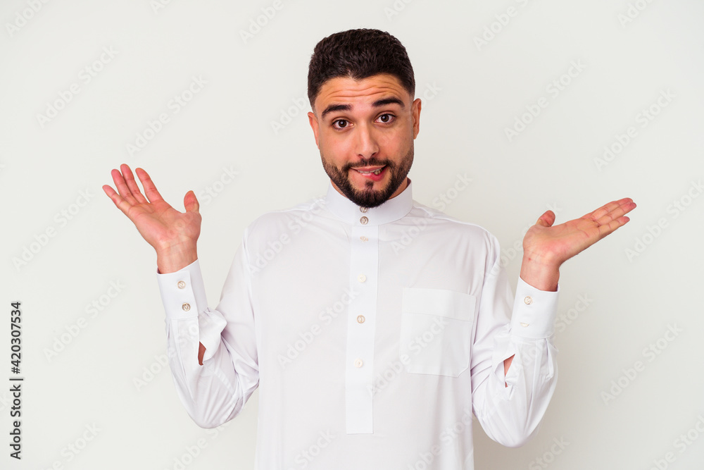 Young arab man wearing typical arab clothes isolated on white background Young arab man wearing typical arab clothes isolated on white background