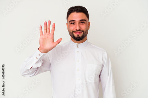 Young arab man wearing typical arab clothes isolated on white background