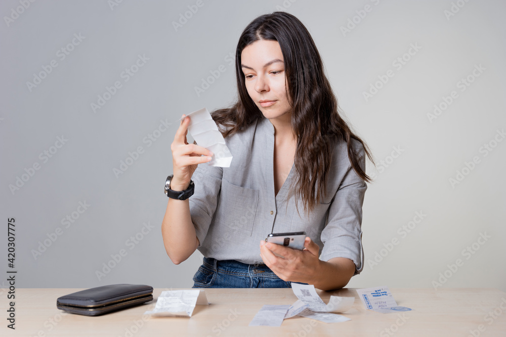 Personal Finance, the frustrated woman considers the costs, receipts and invoices, Personal Finance, the frustrated woman considers the costs, receipts and invoices,