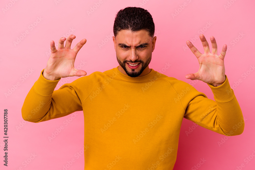 Young mixed race man isolated on pink background Young mixed race man isolated on pink background