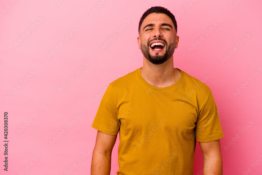 Young mixed race man isolated on pink background Young mixed race man isolated on pink background