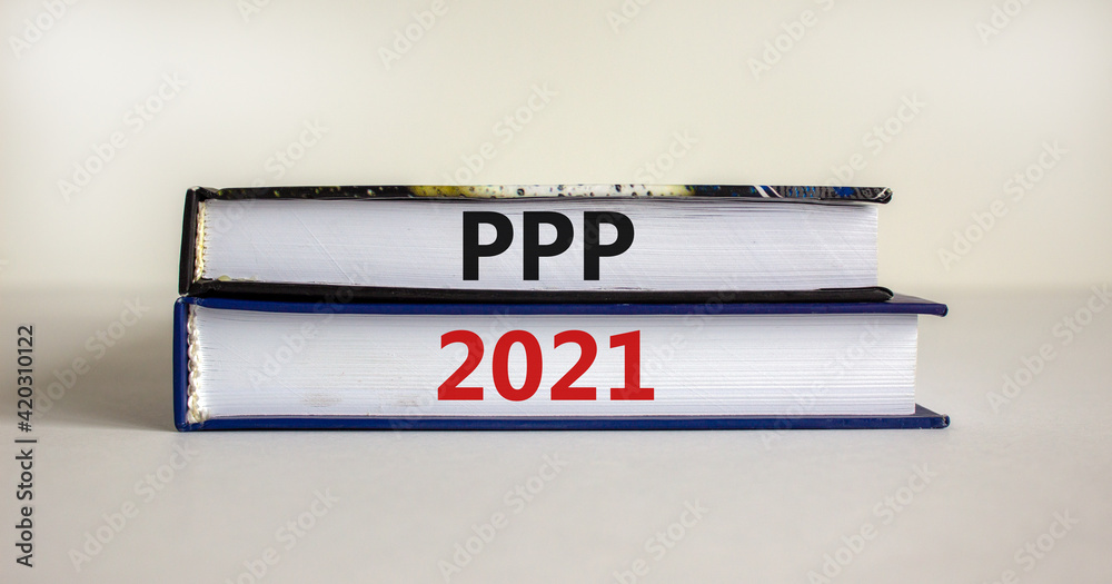 PPP, paycheck protection program 2021 symbol. Concept words PPP, paycheck protection program 2021 on books on a beautiful white background. Business, PPP paycheck protection program 2021 concept.