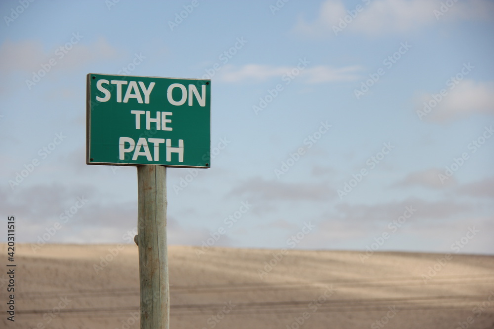 sign on the road, stay on the path.