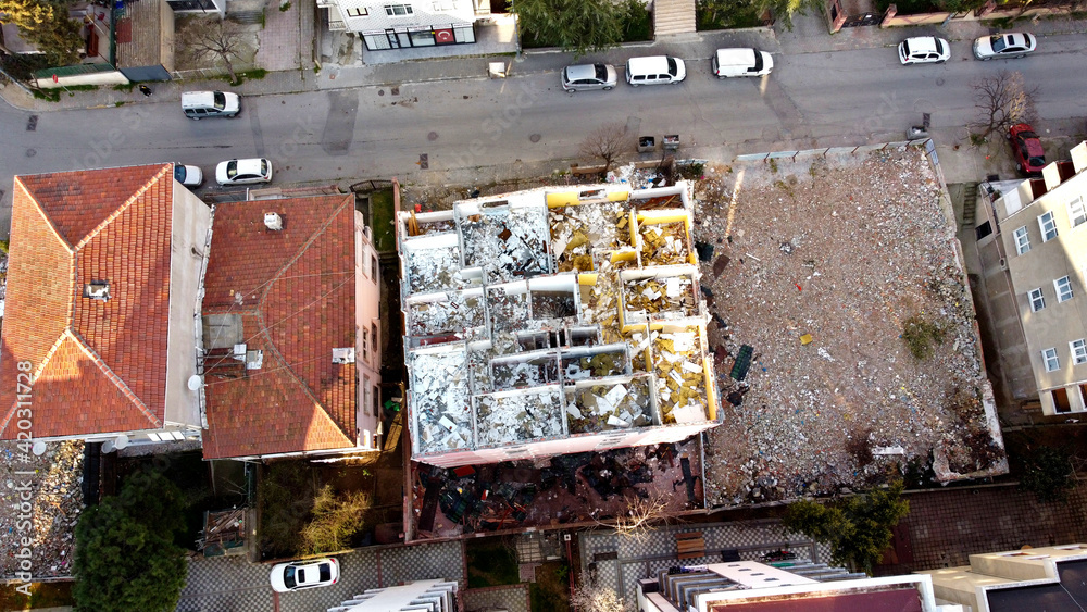 An apartment building in Istanbul, Turkey, destroyed and ready for demolition photographed from the air, bird's eye view. Without roof.