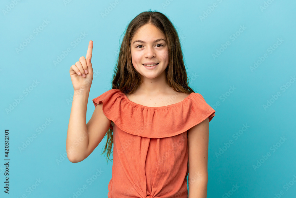 Little caucasian girl isolated on blue background pointing up a great idea Little caucasian girl isolated on blue background pointing up a great idea