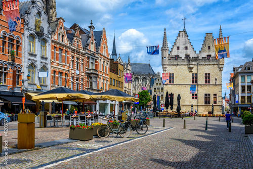 Old street with tables of cafe in Mechelen, Belgium. Mechelen is a city and municipality in the province of Antwerp, Flanders, Belgium. photo