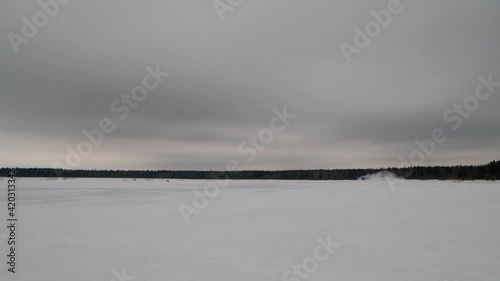 Winter avaiation. A small biplane takes off.