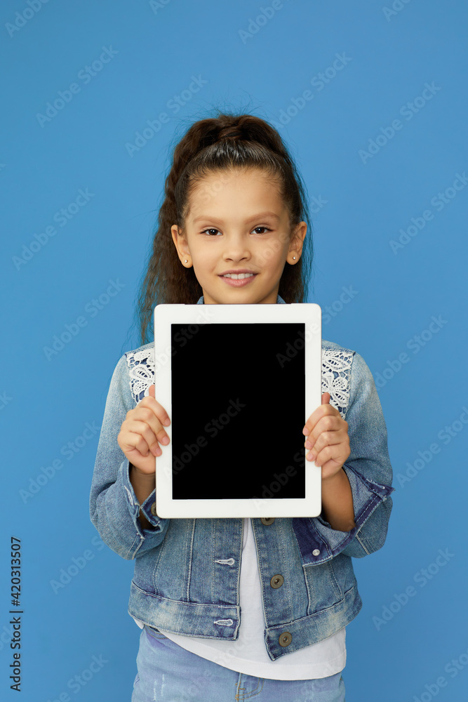 cute little child girl shows empty tablet cute little child girl shows empty tablet