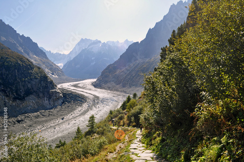 A massive glacier that stretches through a deep valley in the French Alps - Mer de Glace, France