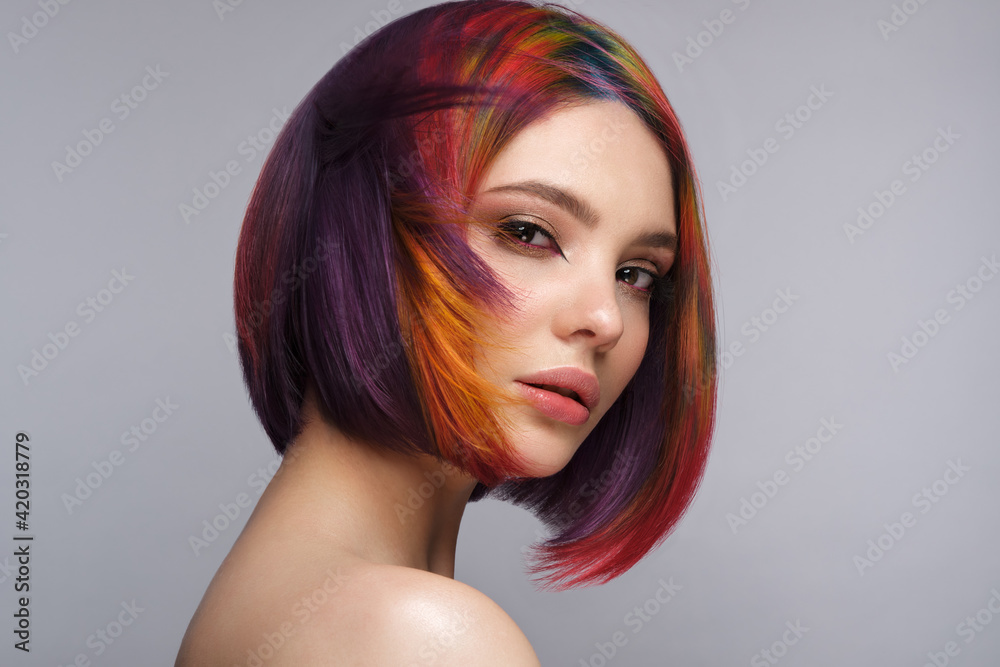 Beautiful woman with multi-colored rainbow hair and creative hairstyle.  28901248 Stock Photo at Vecteezy