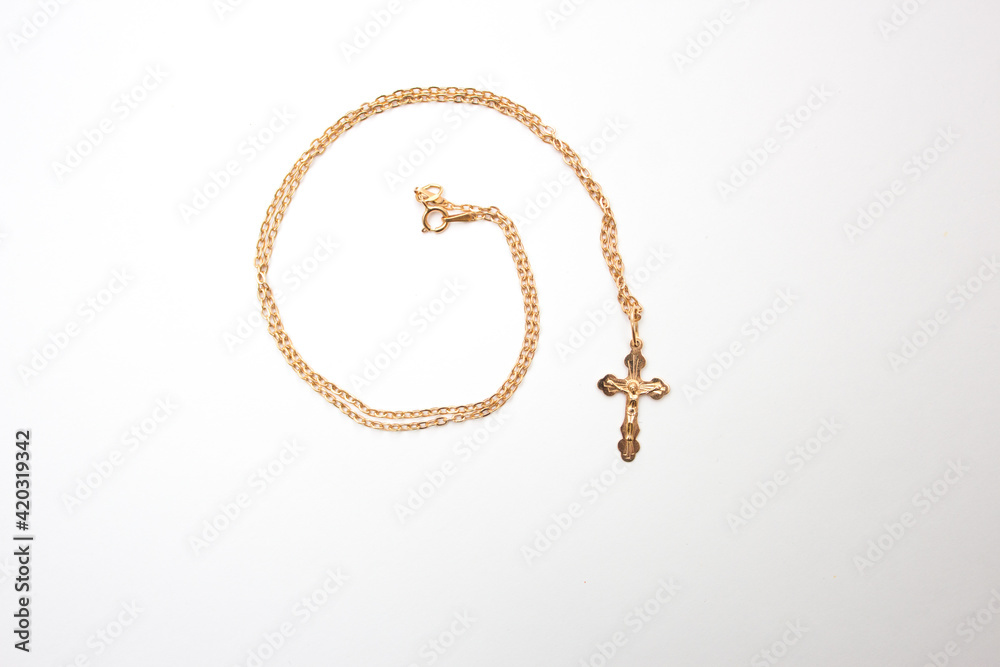 Gold cross with chain, cross for the baptism of a Christian baby. Gold cross with chain, cross for the baptism of a Christian baby.