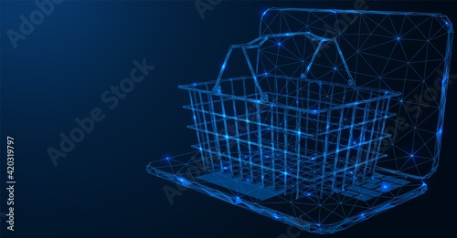 Online store. Wire shopping cart on the laptop. Polygonal construction of lines of points. Free space for information. Blue background. photo