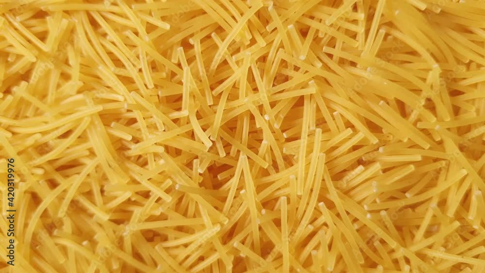 Flat lay close up macro of raw italian pasta filini vermicelles recipe with eggs inside template with copy space Fresh food nutrition fill the frame and move to the top around cooking at home concept Flat lay close up macro of raw italian pasta filini vermicelles recipe with eggs inside template with copy space Fresh food nutrition fill the frame and move to the top around cooking at home concept