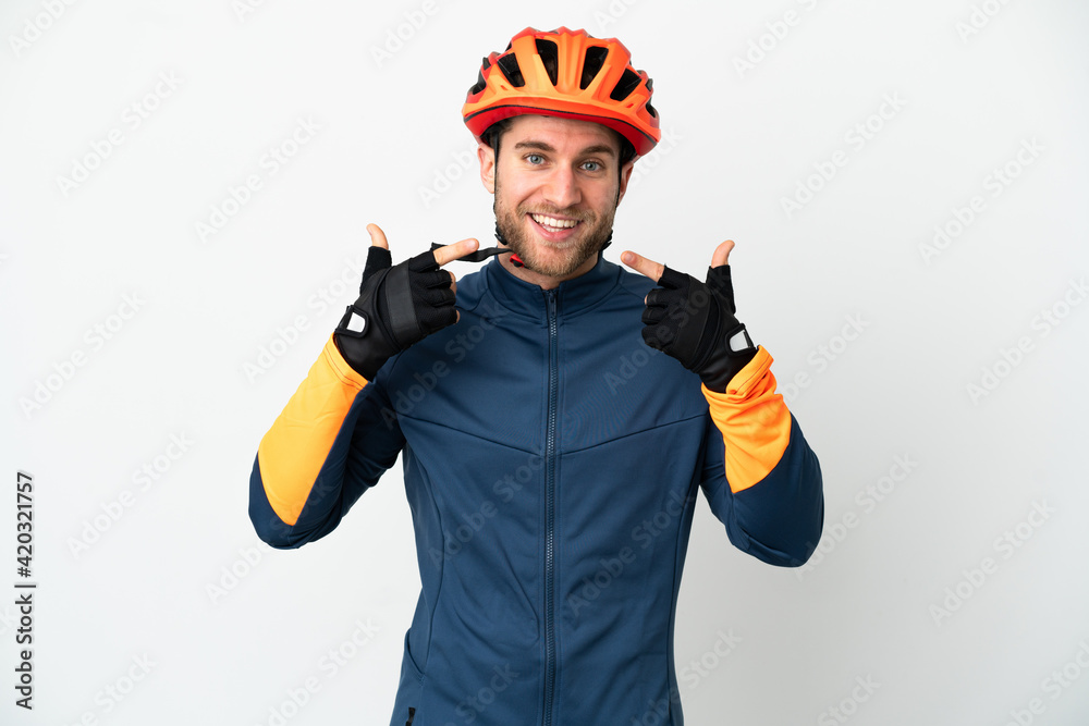 Young cyclist man isolated on white background giving a thumbs up gesture Young cyclist man isolated on white background giving a thumbs up gesture
