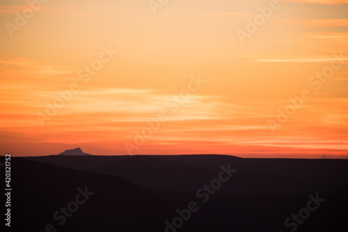 Colorful sunset over the mountain hills. Beautiful landscape in Azerbaijan nature.