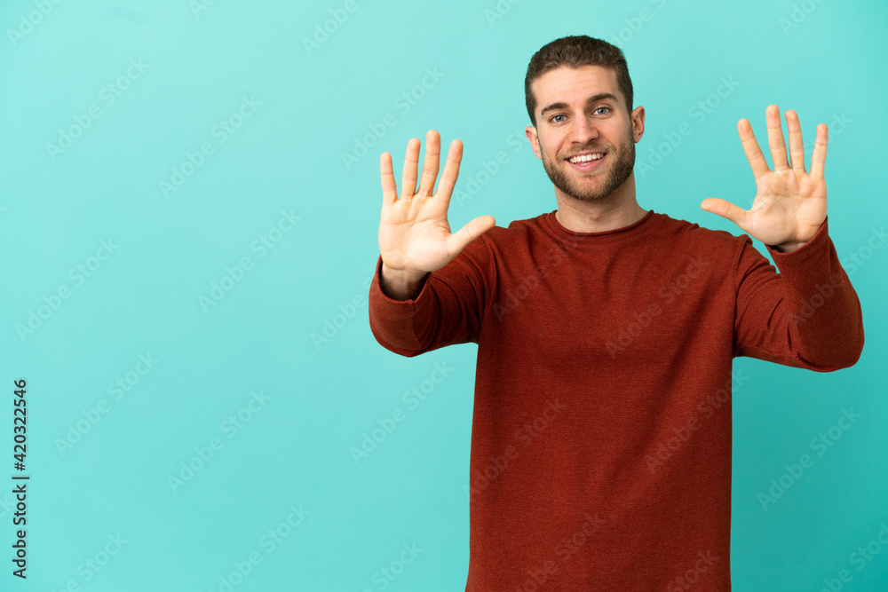 Handsome blonde man over isolated blue background counting ten with fingers Handsome blonde man over isolated blue background counting ten with fingers