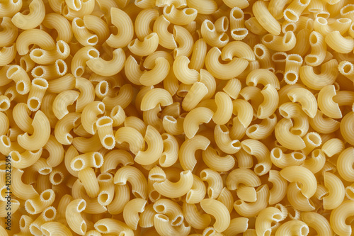 raw pasta background. Italian food. advertising poster concept. texture of italian pasta.