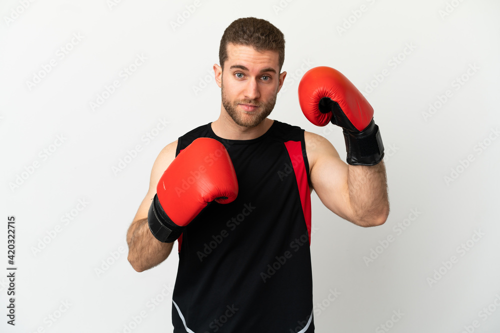 Handsome blonde man over isolated white background with boxing gloves
