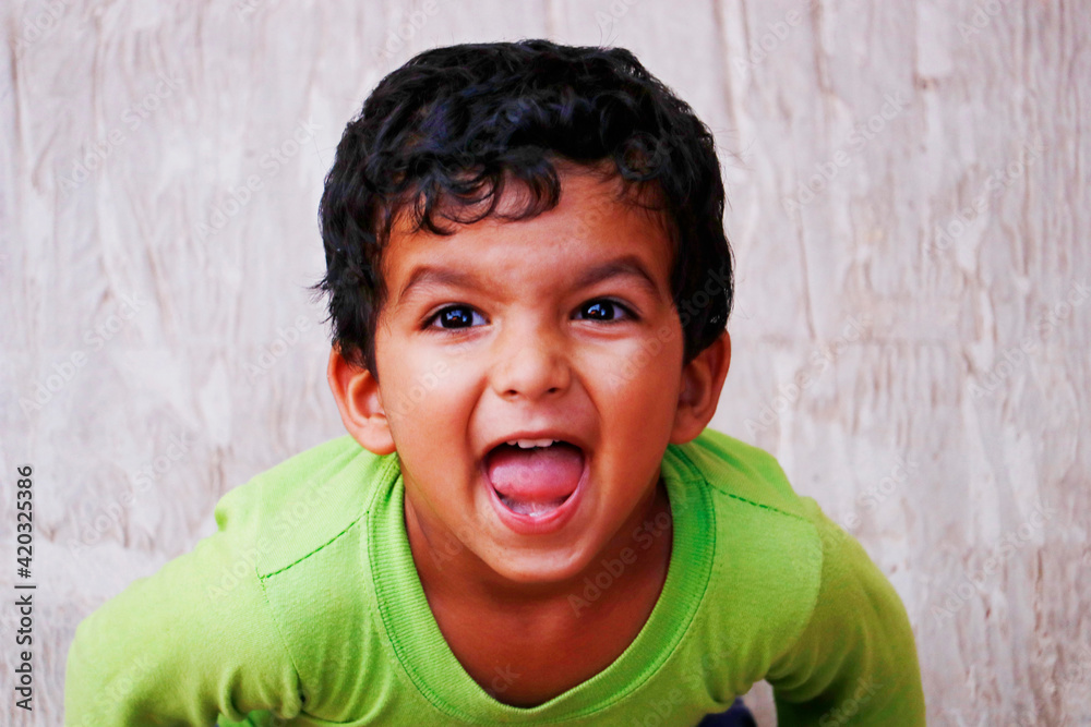 three year old indian baby boy in green t shirt three year old indian baby boy in green t shirt