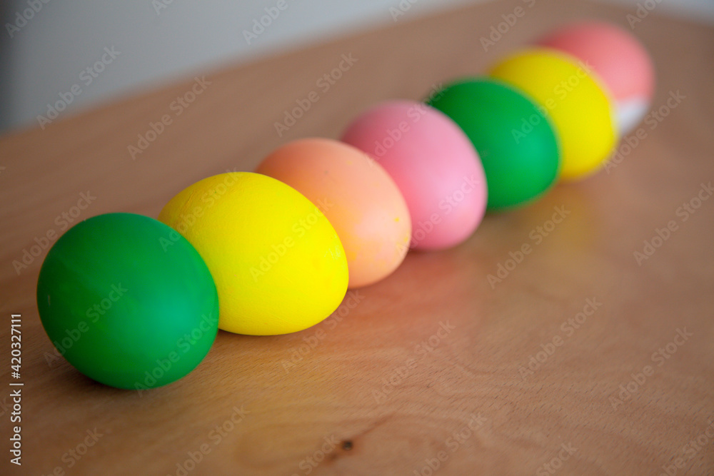 Easter pattern of Eggs with flowers and candies on the white background. Easter concept. Healthy feeding concept. Easter pattern of Eggs with flowers and candies on the white background. Easter concept. Healthy feeding concept.