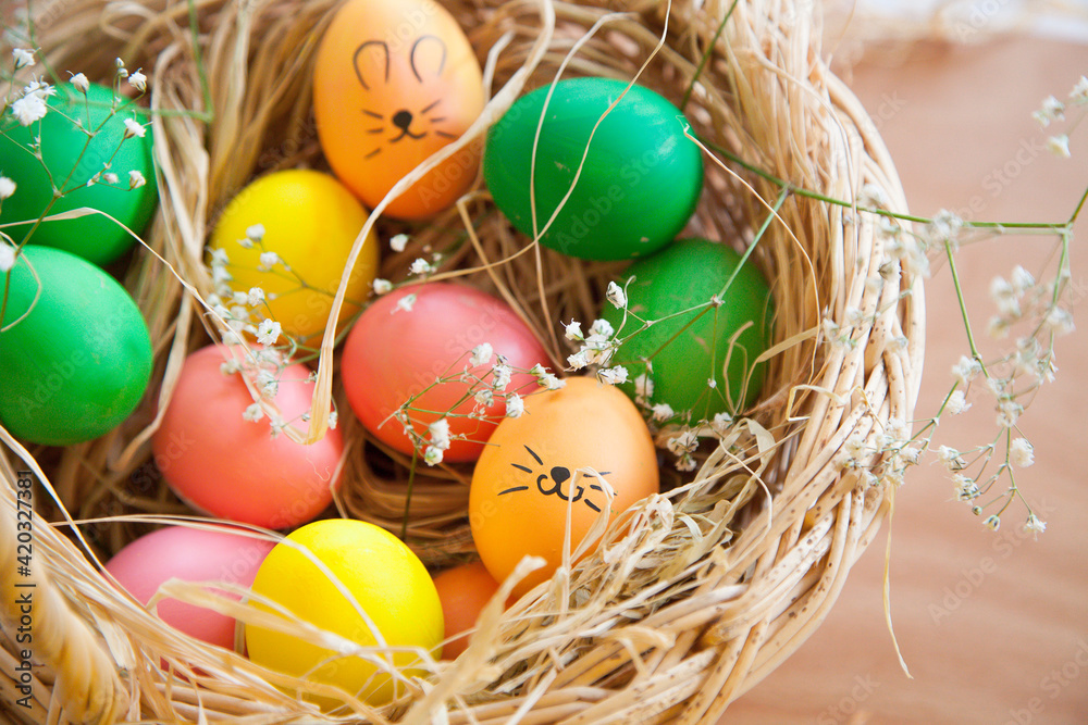 Easter pattern of Eggs with flowers and candies on the white background. Easter concept. Healthy feeding concept. Easter pattern of Eggs with flowers and candies on the white background. Easter concept. Healthy feeding concept.