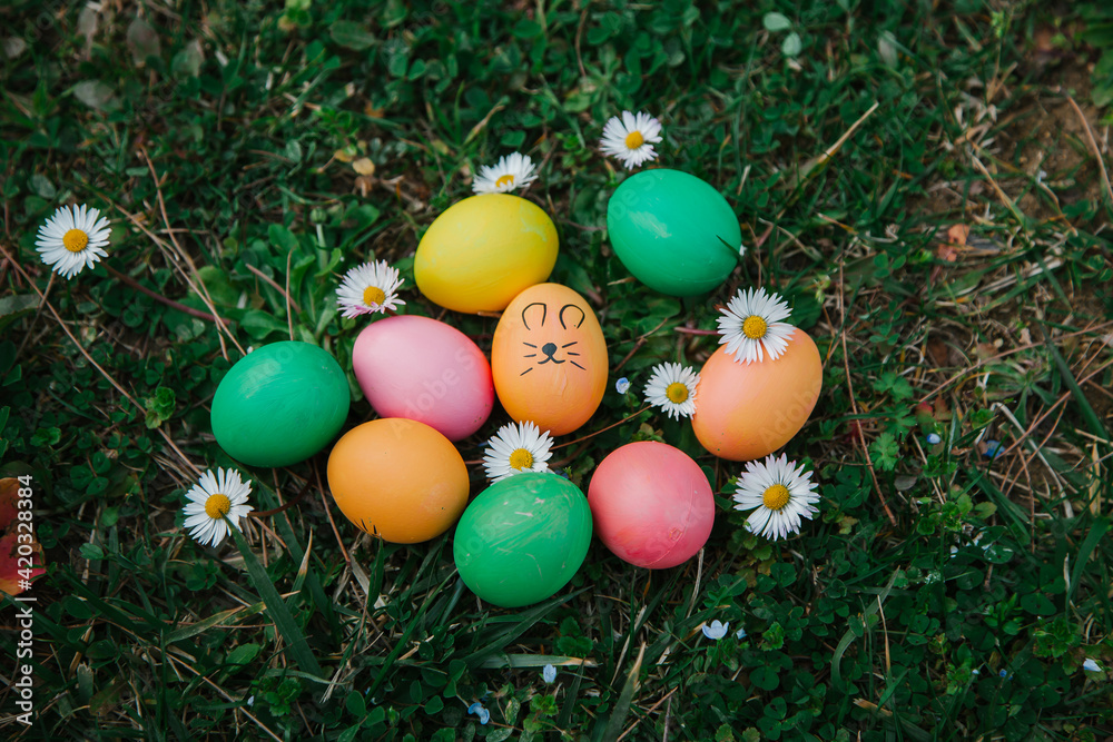Easter concept. Easter Eggs outdoors on the grass. Egg hunt concept. Easter concept. Easter Eggs outdoors on the grass. Egg hunt concept.
