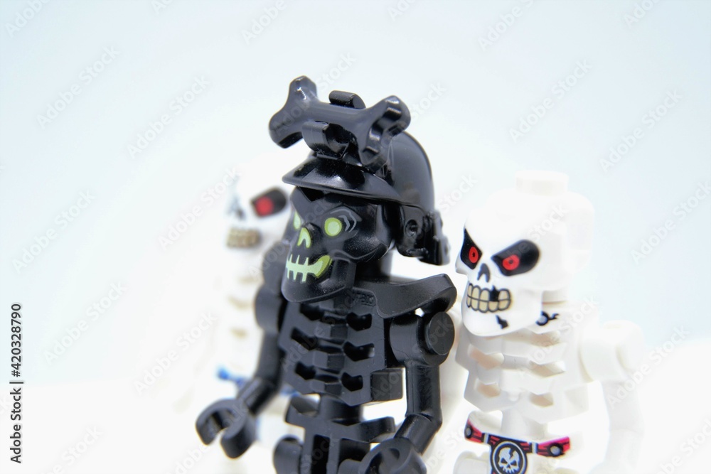 Lego Ninjago minifigures. The Awakened Warrior, also known as the  Re-Awakened, black skeleton and Skulkin army warriors. Closeup, selective  focus. Warsaw, Poland - March 3 2021 Stock Photo | Adobe Stock