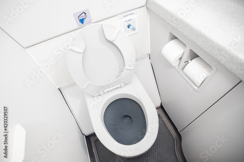 Photography Airplane passenger lavatory toilet seat and water wash basin