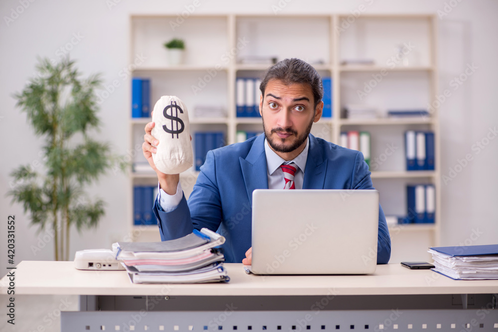 Young male employee in remuneration concept