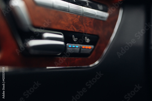 Close up shot of modern car console with seat ventilation heating controls