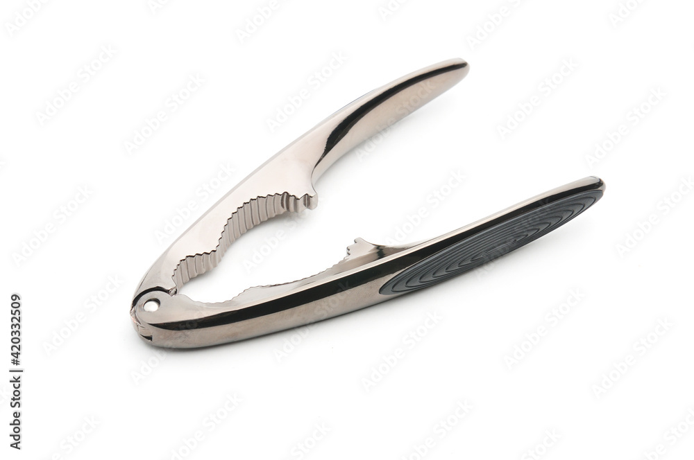 Tongs for nuts on a white background Tongs for nuts on a white background