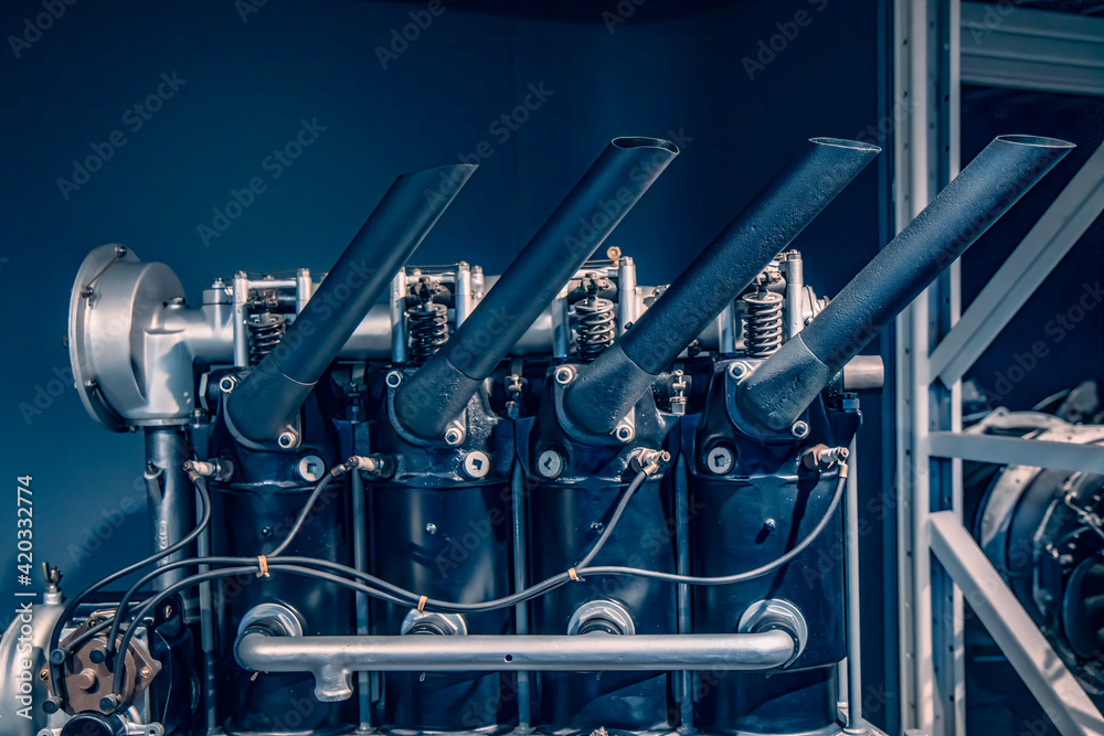 Side view of vintage internal combustion aircraft engine showing