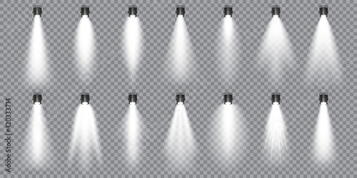 Illuminated studio spotlights collection. Bright light beam. Transparent realistic effect. Stage lighting. Glowing light rays. Vector illustration.