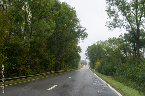 Driving on asphalt road in cloudy rainy day