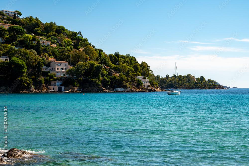 Summer vacation on French Riviera, crystal clear azure blue water of  Mediterranean sea in Saint Clair near Le Lavandou, Var, Provence, France