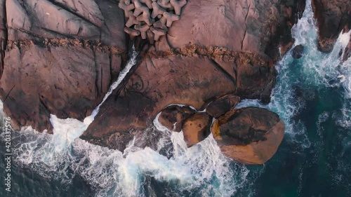 Ocean waves hit the rock formation of sea coast. Beautiful nature footage took with drone. 4K, 30fps