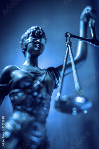 lady justice statue with scales and blindfold © aerogondo