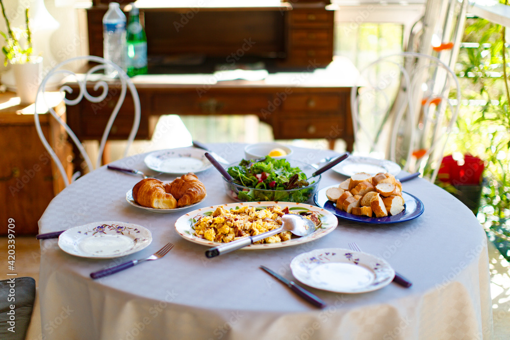 Breakfast on the table in the yard in summertime