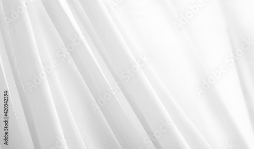 White cloth texture background. White curtains, rippled white silk fabric concept