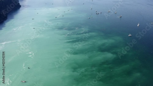 Pull back revealing fishing boats during herring spawn