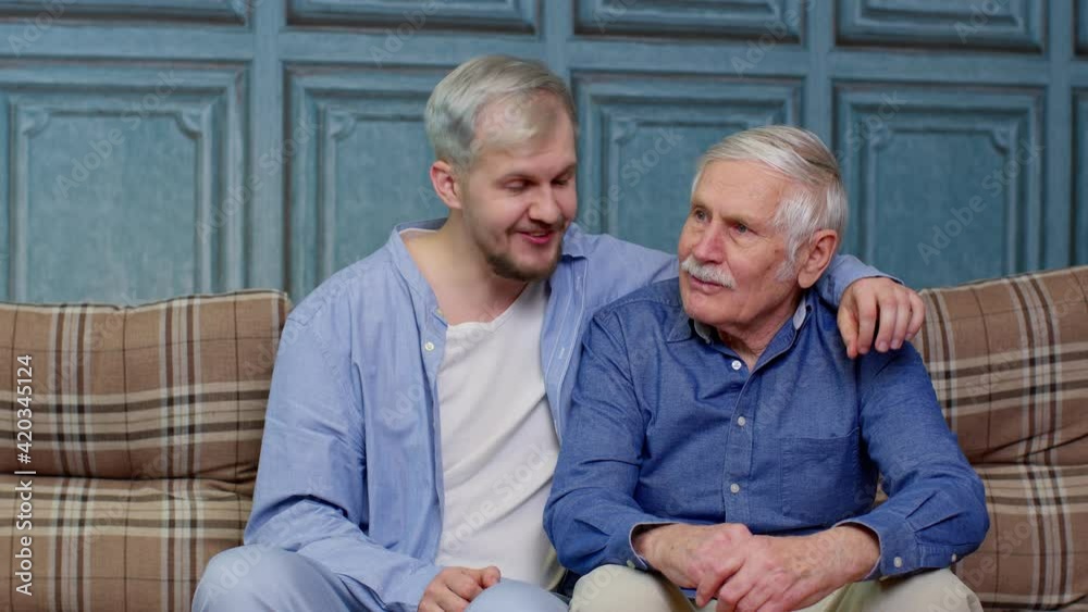Family of senior father and adult son man or grandson having heart-to-heart conversation at home Family of senior father and adult son man or grandson having heart-to-heart conversation at home