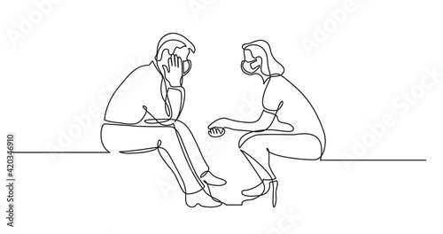 young man and woman wearing face masks talking having conversation
