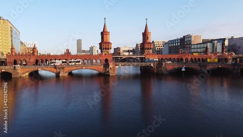 Beautiful Oberbaum Bridge over River Spree in Berlin from above - aerial view. Amazing drone footage photo