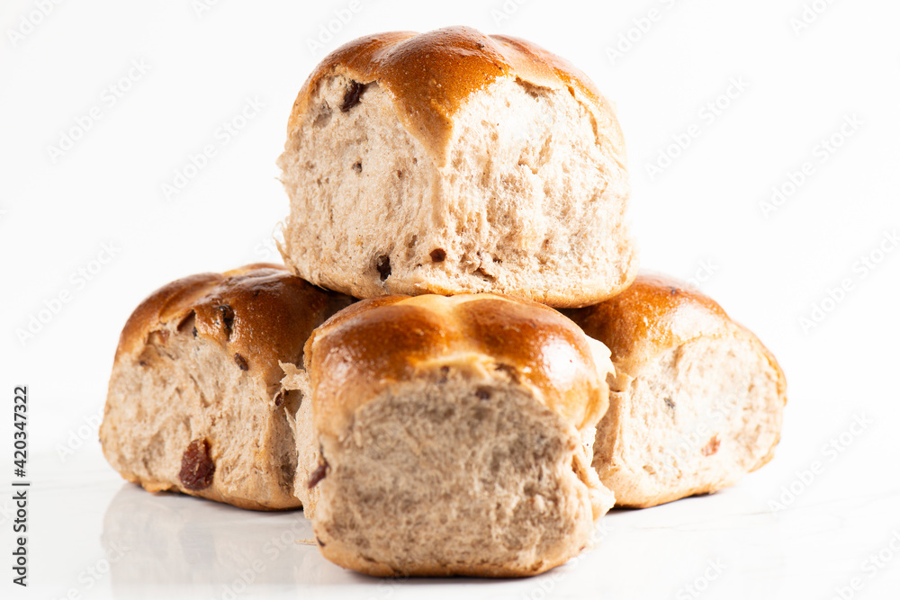 Fresh baked traditional Easter hot cross buns with raisins. Fresh baked traditional Easter hot cross buns with raisins.
