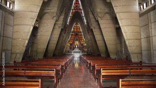 Wooden benches in the interior of the Catholic Church of the city of Higuey, Dominican Republic Basilica Catedral Nuestra Señora de La Altagracia  photo