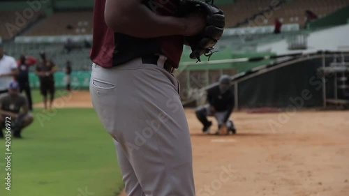 San pedro de macoris, DR - march 12 2021 - baseball player training pitching at the stadium, team training season photo