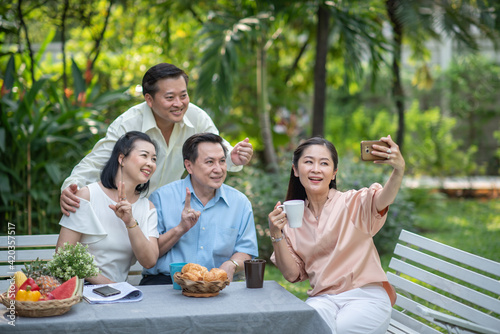 Group of asia family and friends happiness meeting  Lifestyle people middle age outdoor party. Communication social online life of asian people.